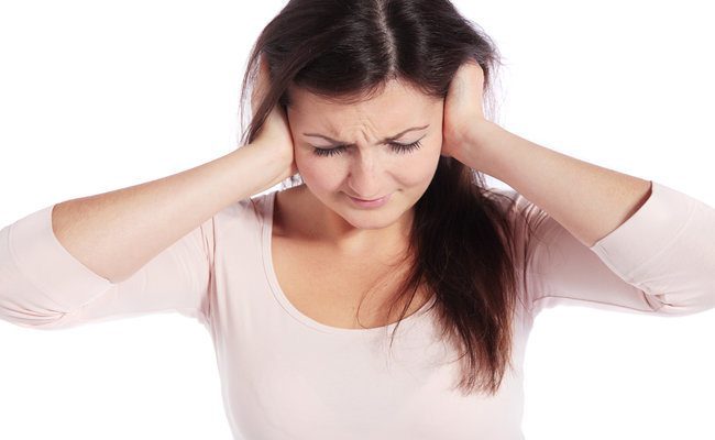 Tinnitus ear infection pain hands over ears